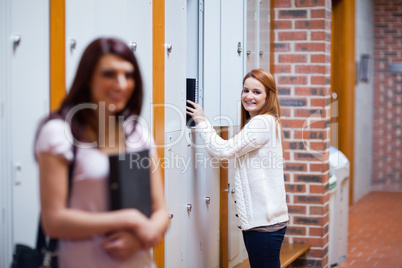 Student picking her binder in her locker