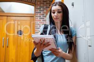 Studious woman reading her notes