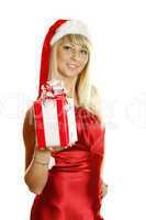 Young woman dressed as Santa with a gift.