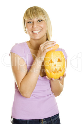 Young woman with a pumpkin for Halloween