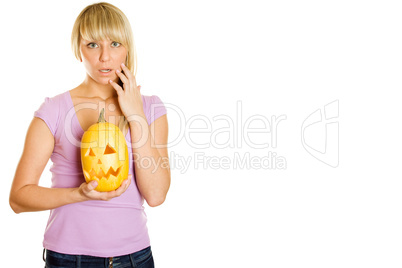 Attractive woman with a pumpkin for Halloween