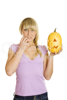 Attractive woman with a pumpkin for Halloween