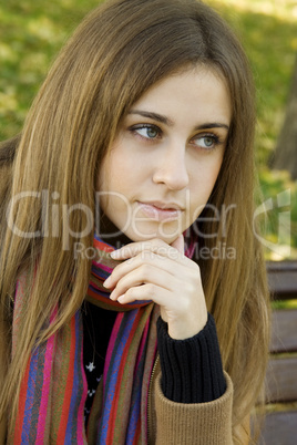 Portrait of an attractive young woman in autumn