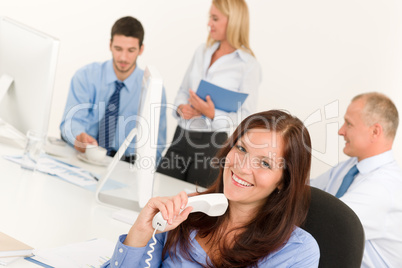 Business team pretty businesswoman holding phone