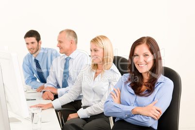 Business team happy sit in line behind table