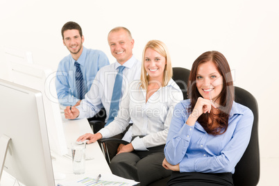 Business team happy sit in line behind table