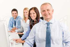 Business team happy sit in line behind table