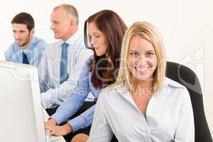 Business team happy sit in line behind table