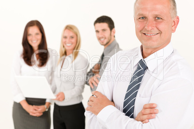 Businessman mature with colleagues stand in back