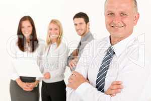 Businessman mature with colleagues stand in back