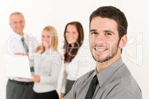 Businessman handsome with colleagues in the back