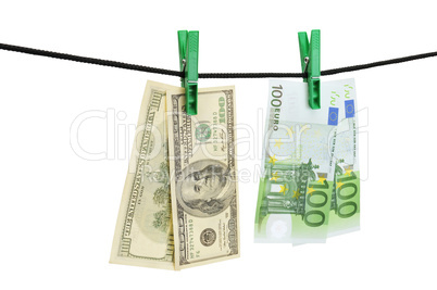 Dollars and euro hanging on a string