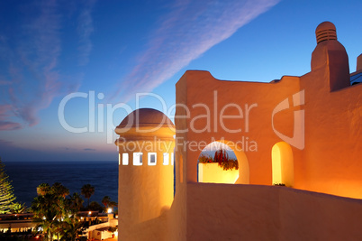 Sunset and building of luxury hotel, Tenerife island, Spain