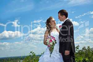 Wedding couple in sunny summer day