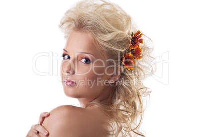 Beauty naked woman portrait with flower blond hair