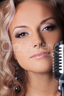 Beauty blond woman portrait with microphone