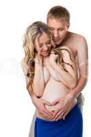 Young man take a belly of nude pregnant wife