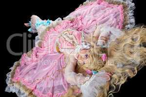 Young woman posing in ball joint doll costume