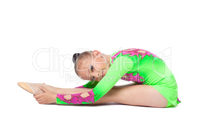 young gymnast in green sit on isolated