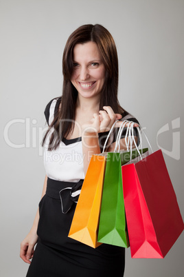 happy shopping girl holding bags