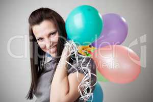 Young slim woman with balloons.