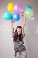 Young slim woman with balloons
