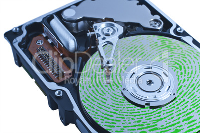 open hard drive with green fingerprint on platter