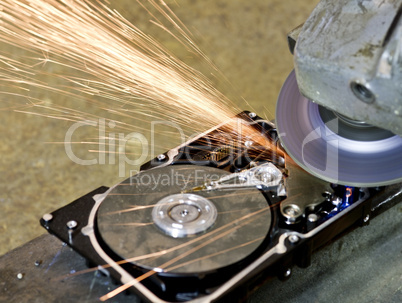 grinder working on open hard drive