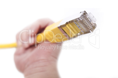 yellow network cable in babys hand