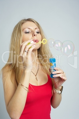 Pretty girl with soap bubbles