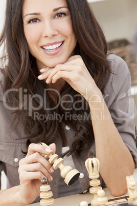 Beautiful Brunette Woman Playing Chess
