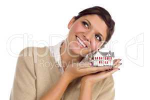 Ethnic Female Daydreaming with Small House on White