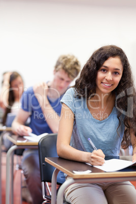 Portrait of smiling students working on an assignment