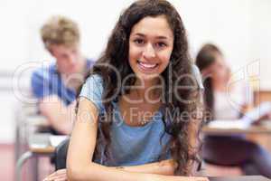 Happy student working on an assignment