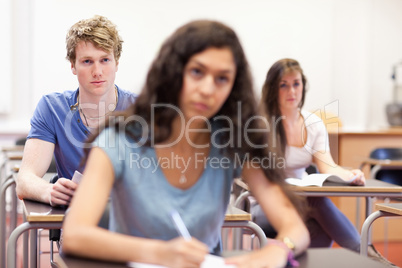 Focused students taking notes