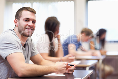 Smiling young man sitting