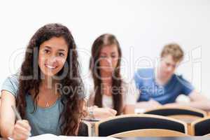 Smiling young students sitting