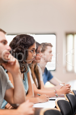Portrait of students listening a lecturer