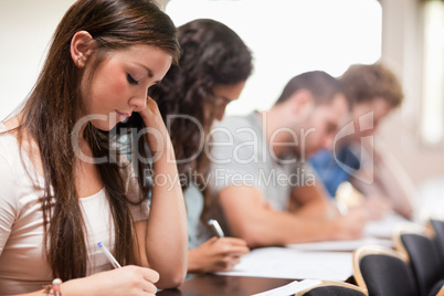 Serious students listening a lecturer