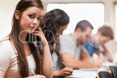 Good looking students listening a lecturer