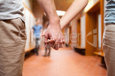 Couple holding hands