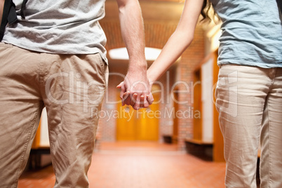 Young couple holding hands