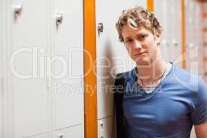 Portrait of a student leaning on a locker