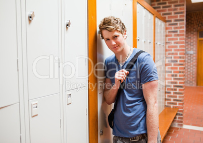 Student leaning on a locker
