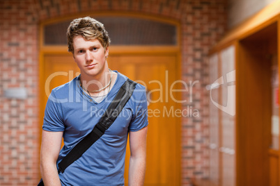 Handsome student standing up