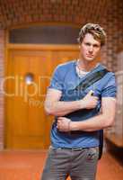 Portrait of a handsome student with a book