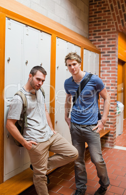 Portrait of handsome students standing up