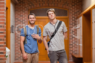 Smiling handsome students posing