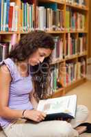 Portrait of a student reading a book