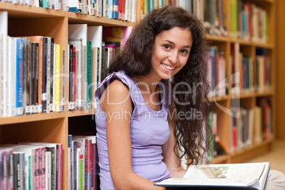 Young student holding a book